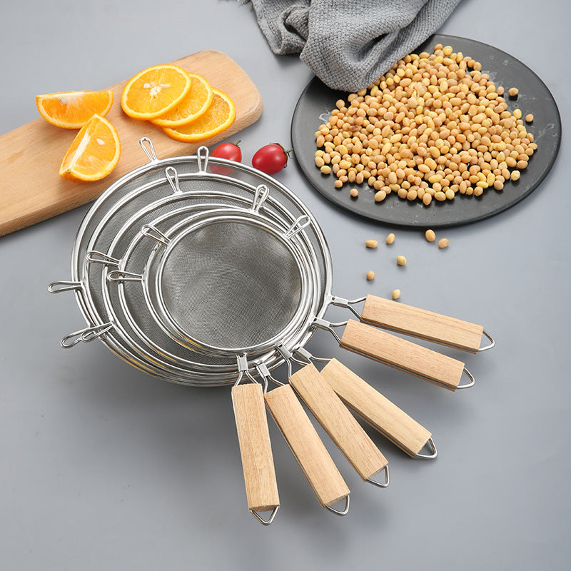 Large stainless steel strainer with wooden handle and double ears, suitable for home use as a frying ladle or noodle strainer