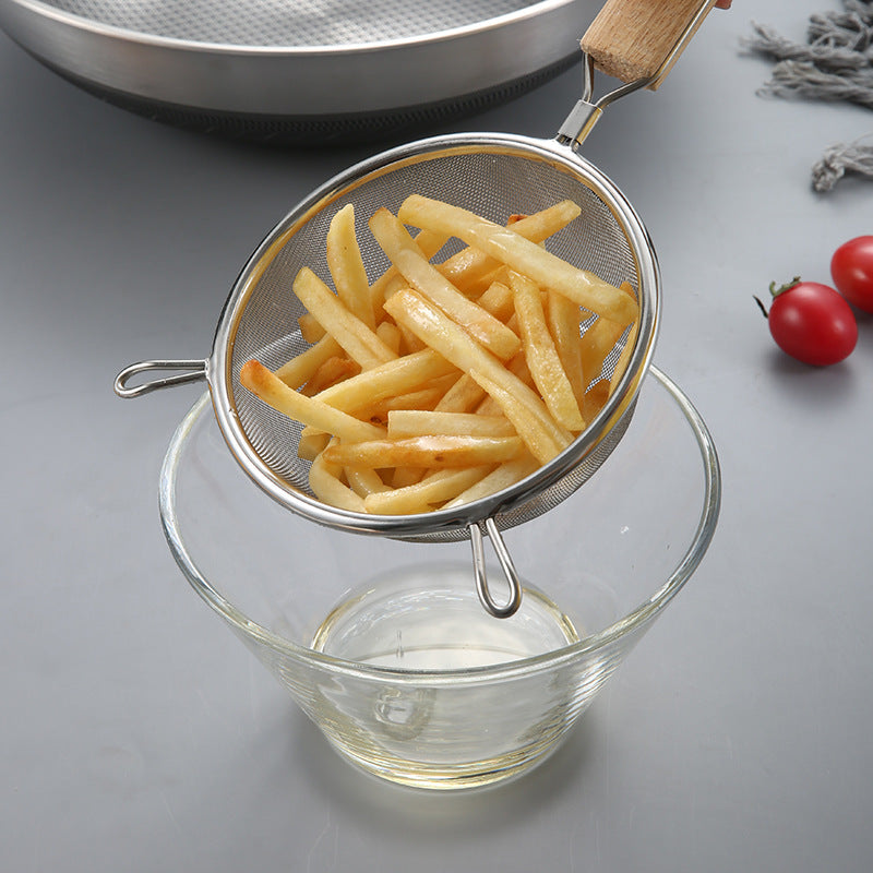 Large stainless steel strainer with wooden handle and double ears, suitable for home use as a frying ladle or noodle strainer