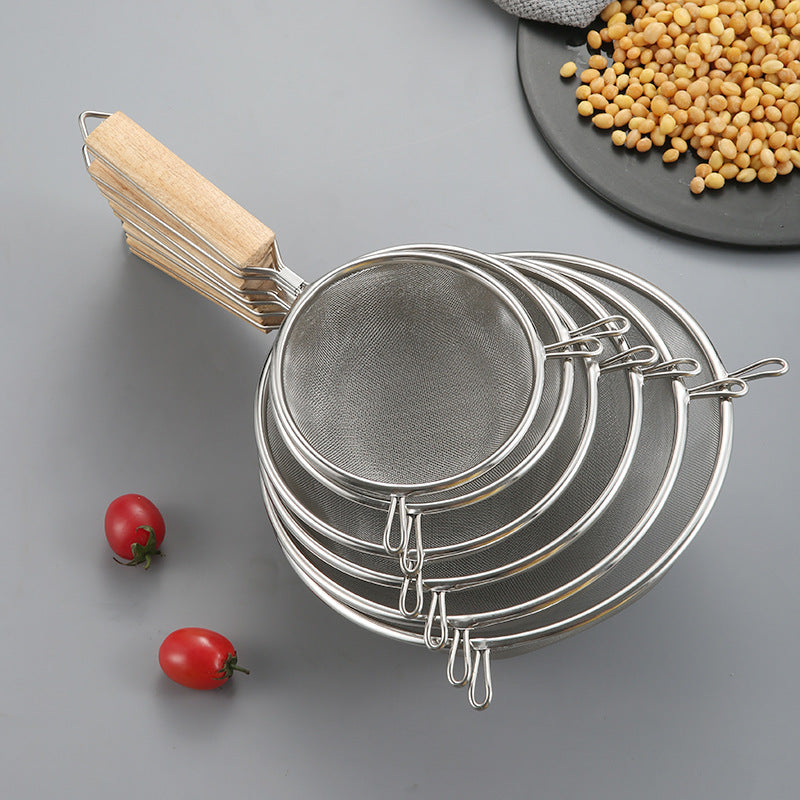 Large stainless steel strainer with wooden handle and double ears, suitable for home use as a frying ladle or noodle strainer